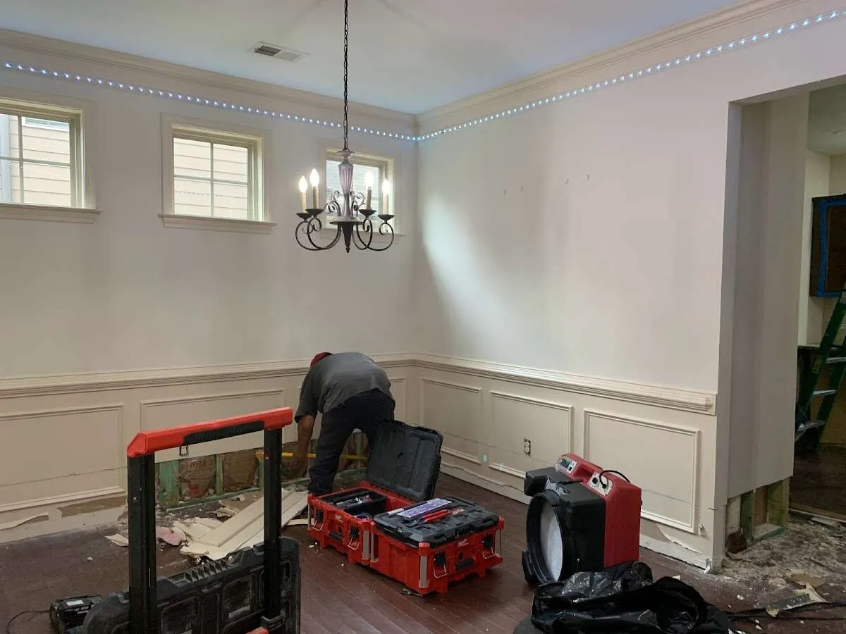 Restoration technician with professional equipment in Absecon